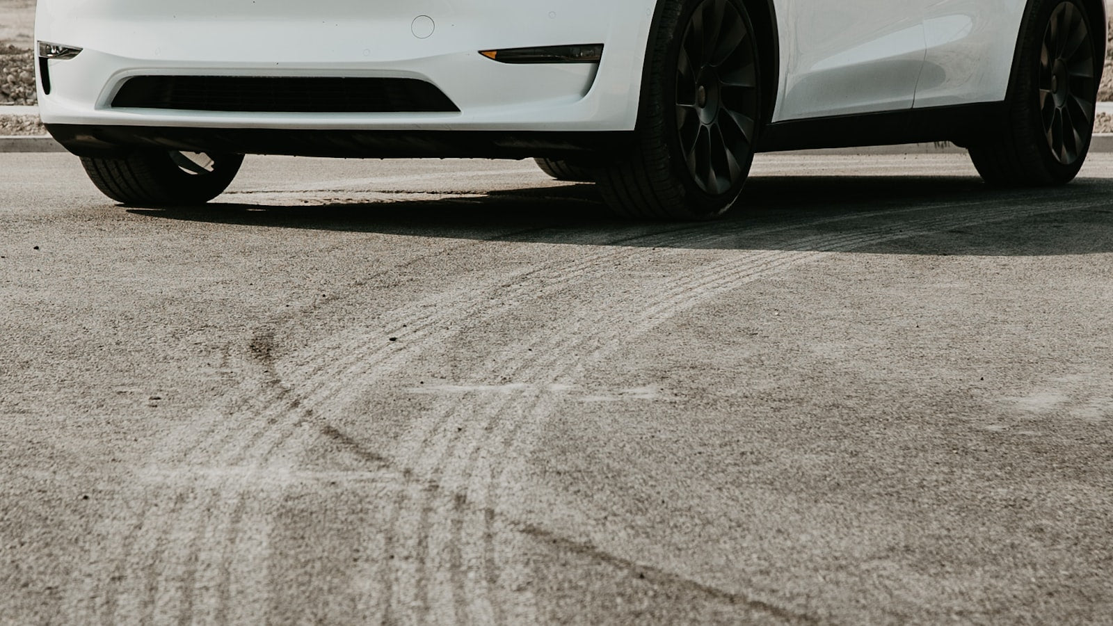 White Tesla Model Y on a country road