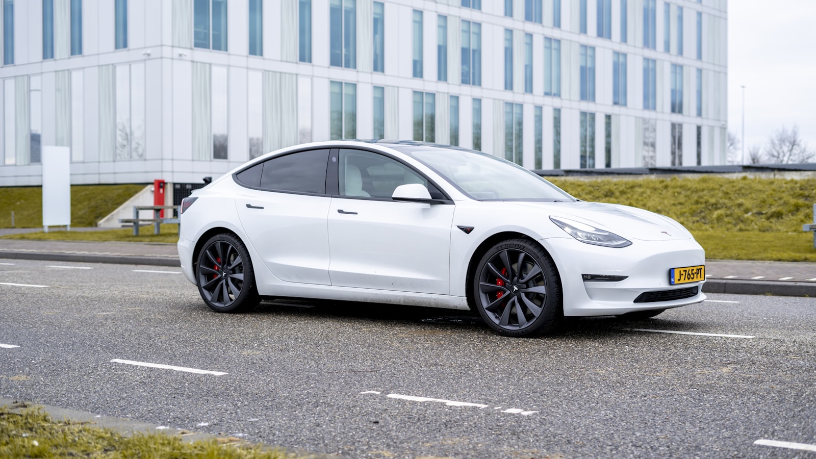 White Tesla Model 3 on the road