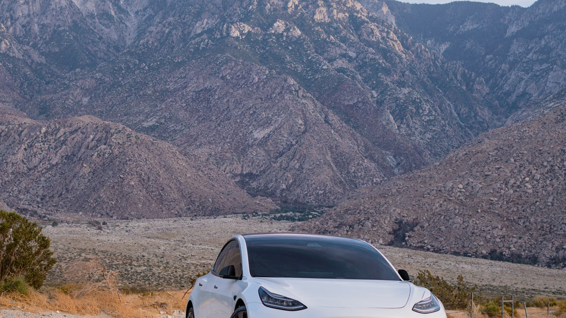 White Tesla Model S in the mountains