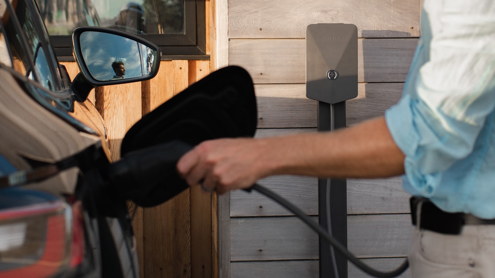 Plugging in to charge an electric vehicle