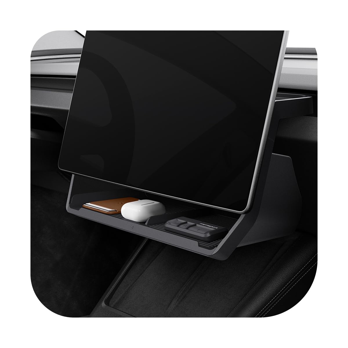 Spigen under-screen storage tray installed in Tesla dashboard