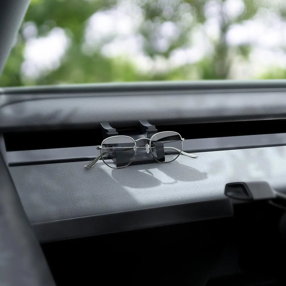 Tesla silicone dash mount holding sunglasses on the dashboard