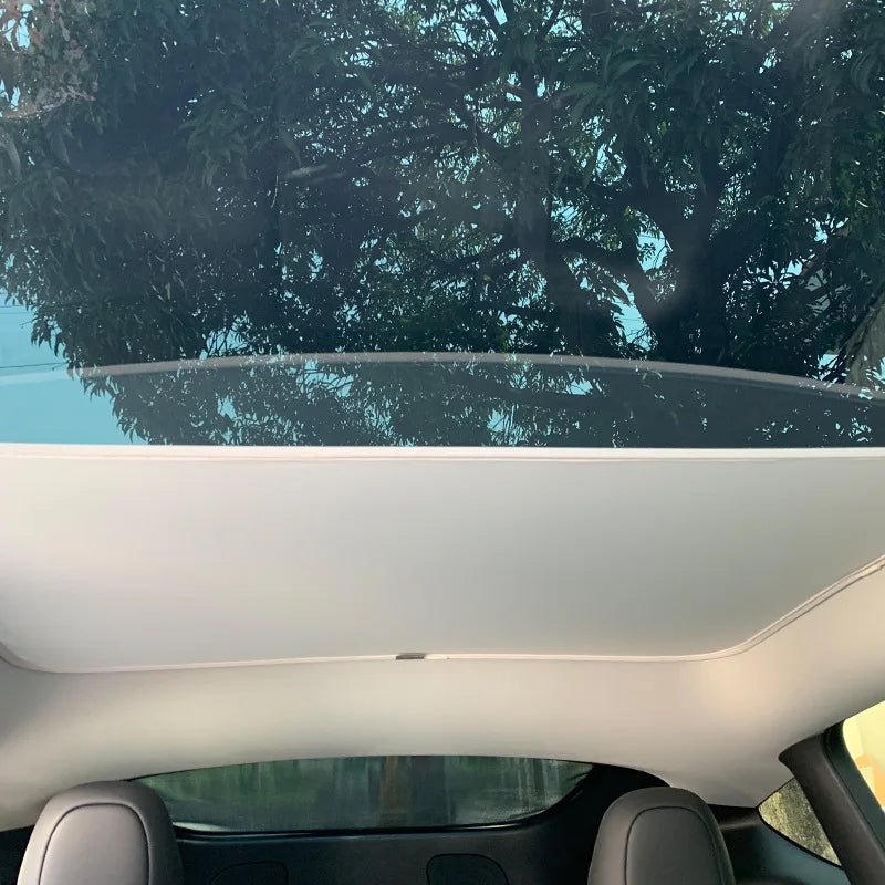 Tesla panoramic glass roof sunshade installed front panel