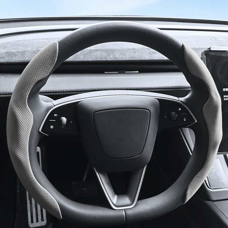 Tesla steering wheel cover installed cabin dashboard view