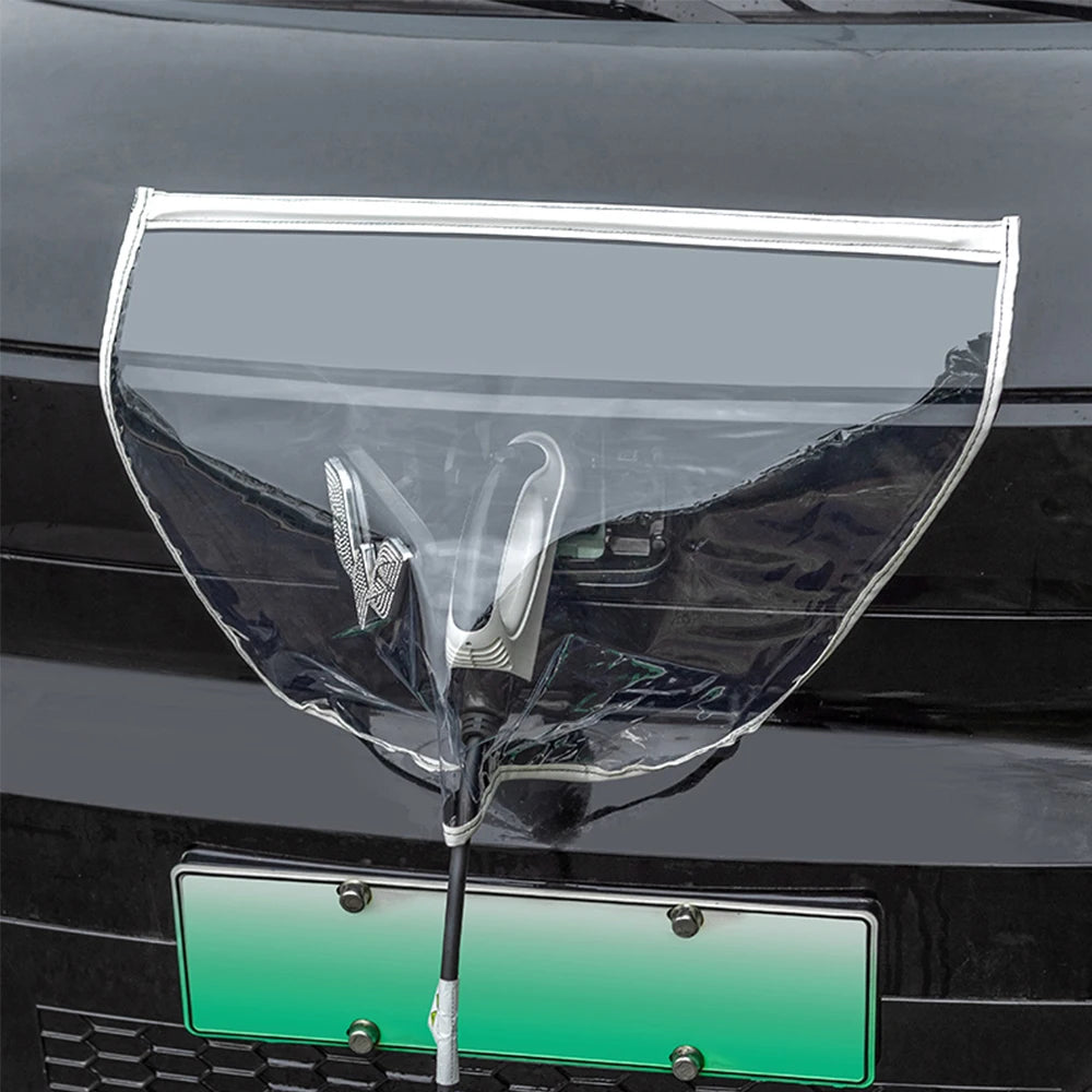 Clear magnetic EV charging port rain cover installed over a connector on a white car