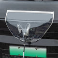 Clear magnetic EV charging port rain cover installed over a connector on a white car