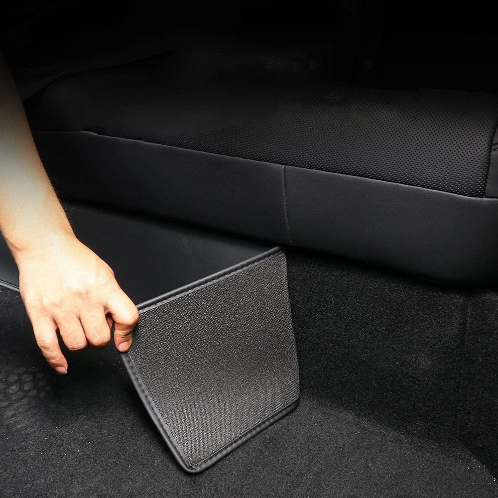 Hand fitting faux-leather threshold anti-dirty pad in Tesla Model Y rear footwell
