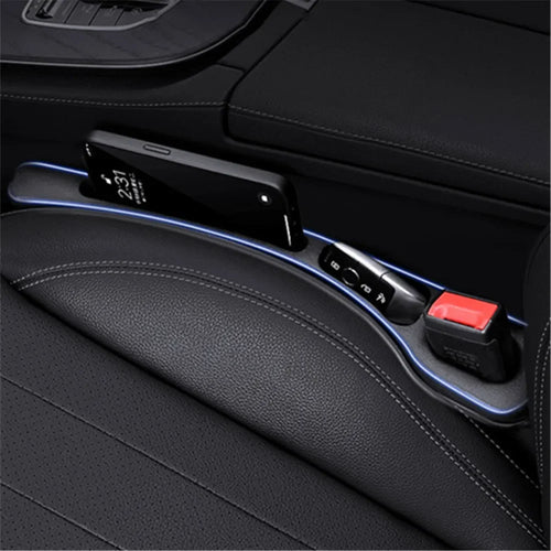 Seat gap filler sealing the crevice between seat and console with phone nearby