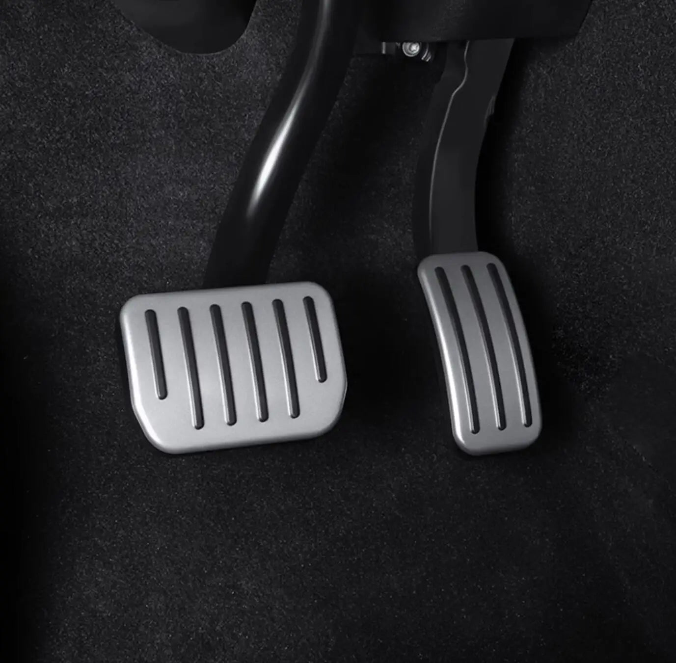 Tesla aluminum performance pedals installed in footwell