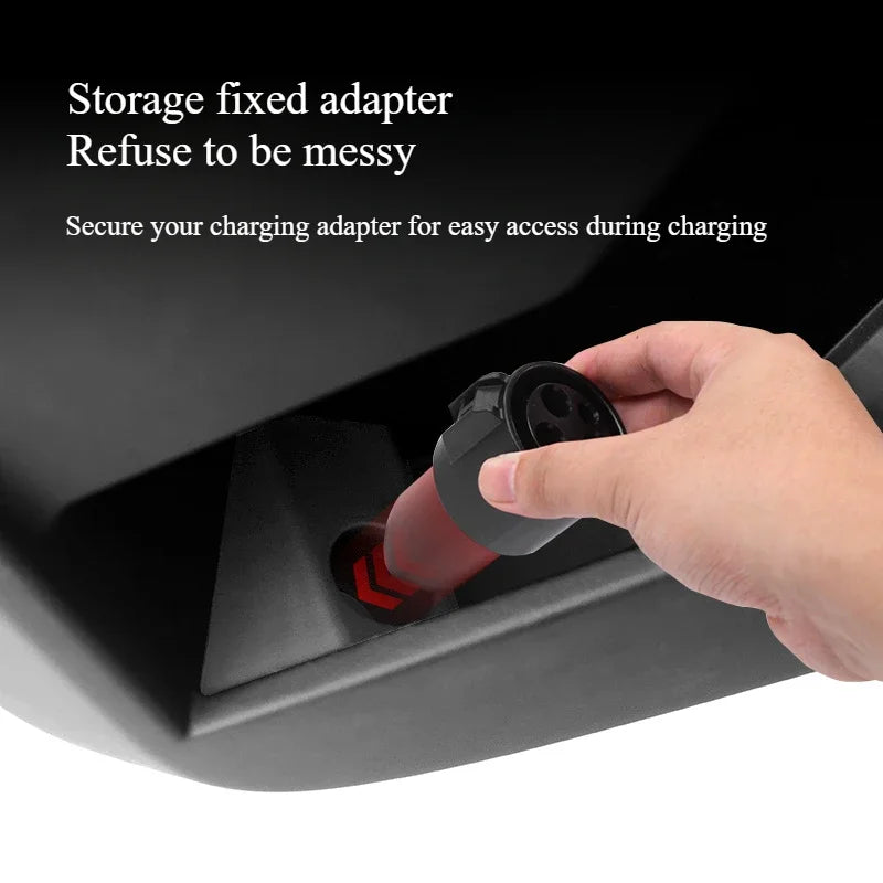 Hand placing a charging adapter into the Cybertruck door dock
