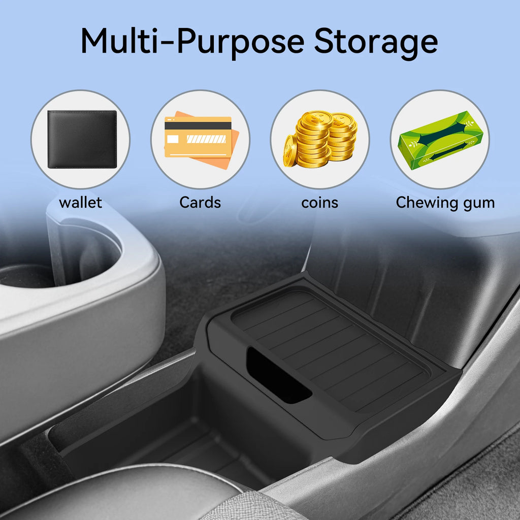 Tesla Model Y console storage tray holding wallet, cards, coins, and gum