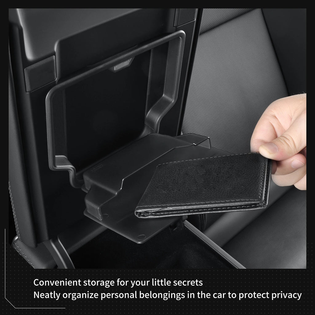 Hand opening the hidden armrest storage compartment in a Tesla