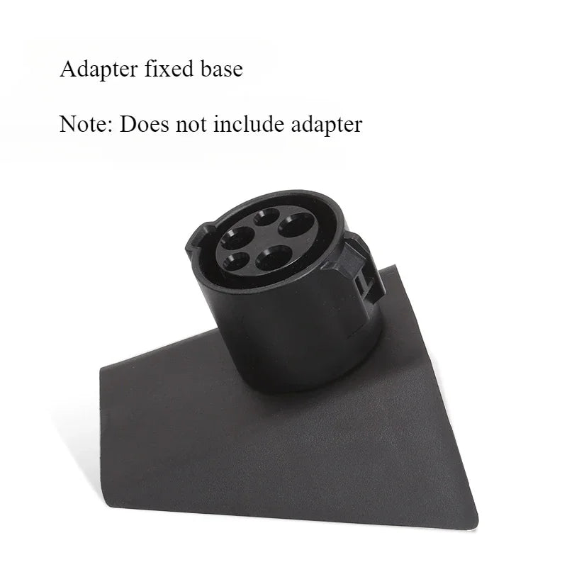 Cybertruck charging adapter storage box shown with adapter for reference