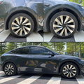 Tesla Model Y Juniper with 19-inch performance wheel covers installed on a parked car