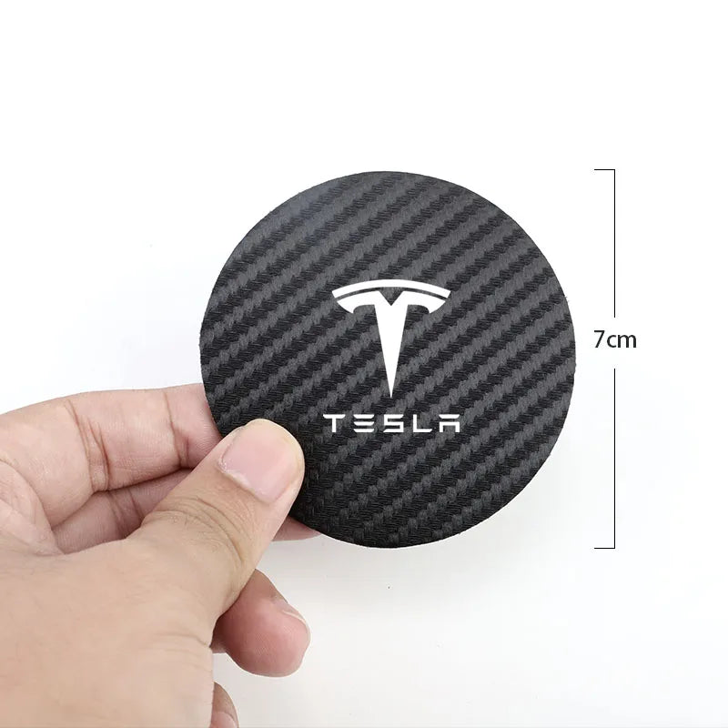 Tesla coaster held in hand showing 7cm diameter