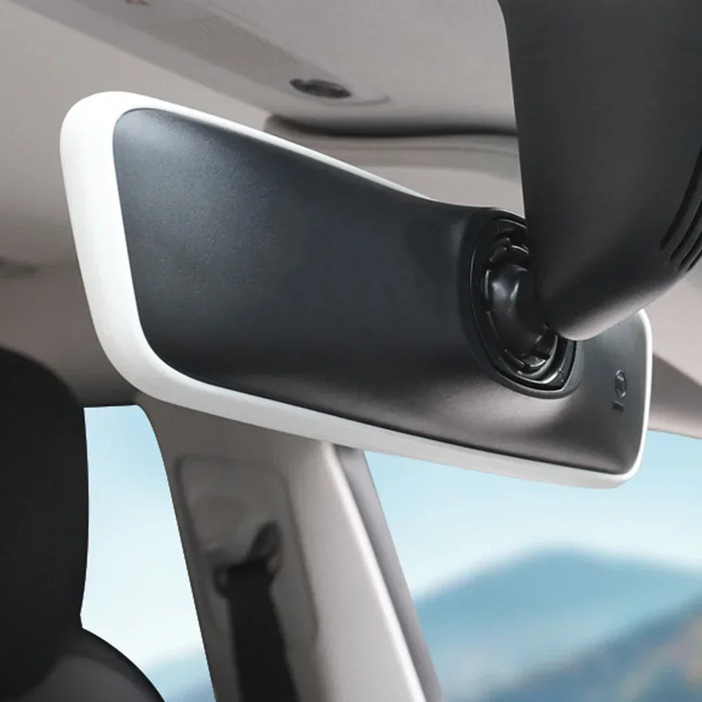 Tesla interior rearview mirror with white silicone frame protector installed