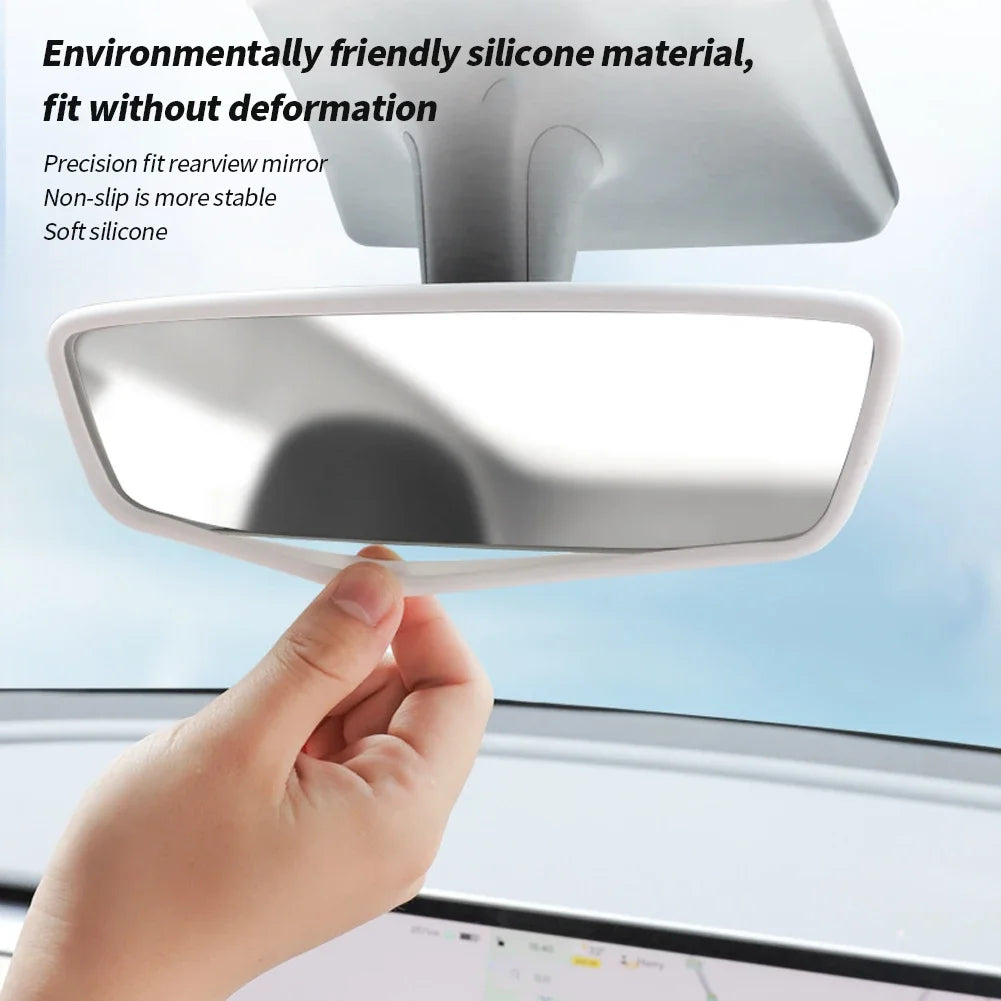 Hand fitting silicone rearview mirror frame protector on Tesla mirror