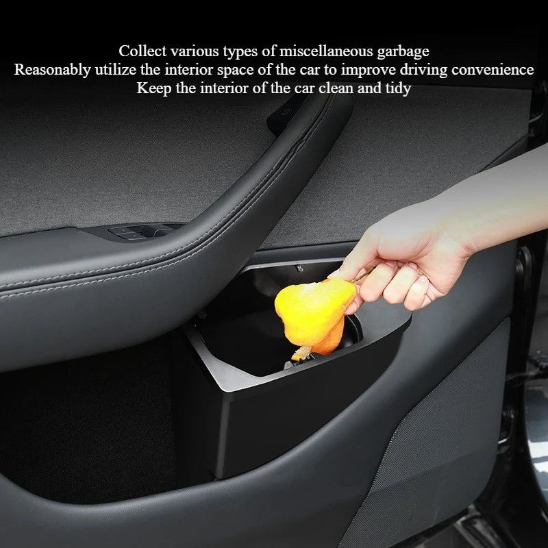 Tesla Model Y front door bin collecting waste in the door pocket