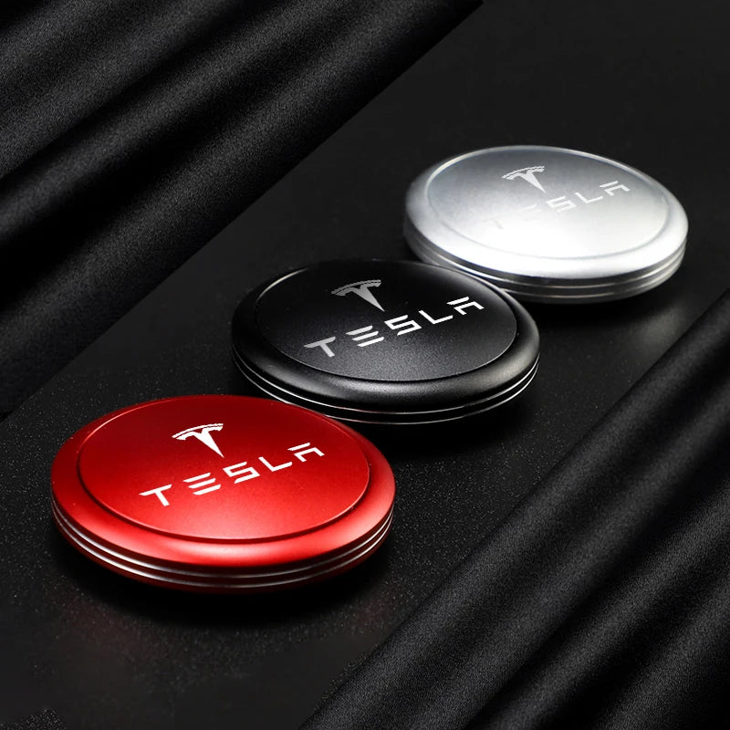 Tesla alloy car air freshener diffusers in silver, black, and red
