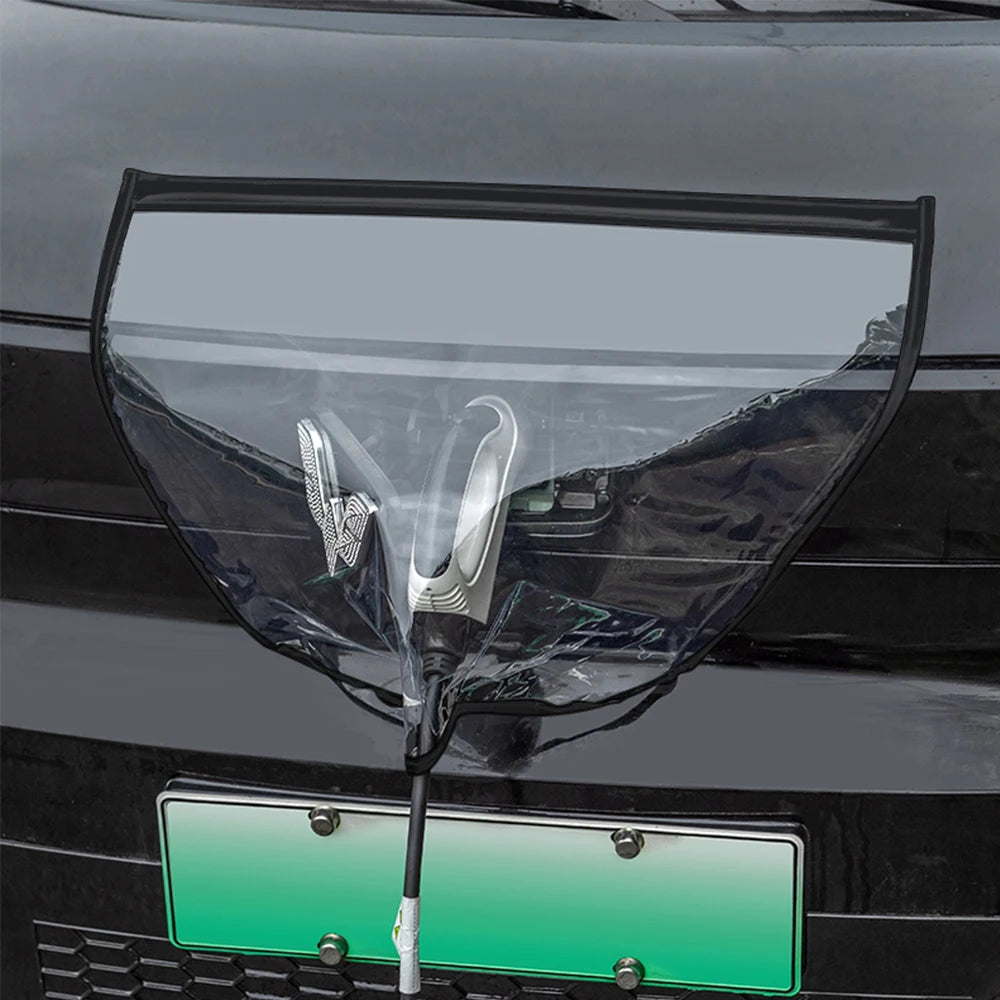 Transparent EV charge-port rain shelter shielding a plugged-in charging gun