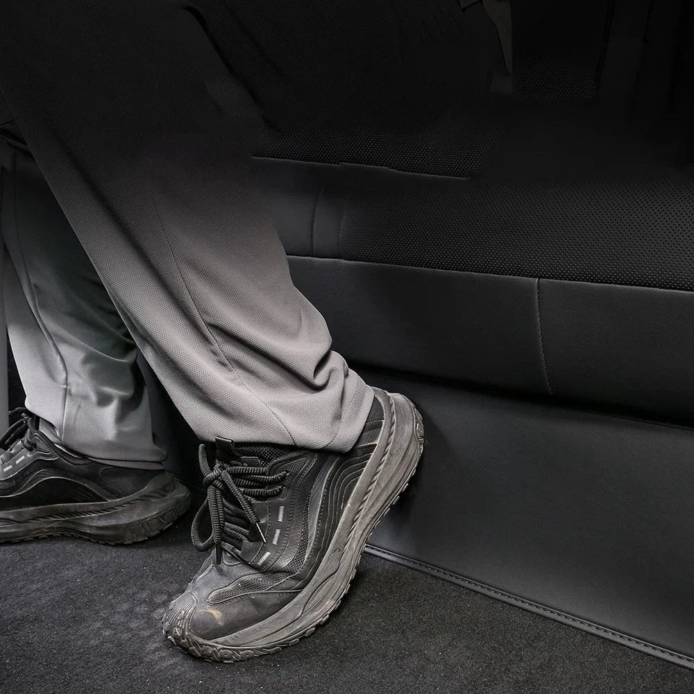 Tesla Model Y rear seat guard protecting seat back from shoe scuffs in use