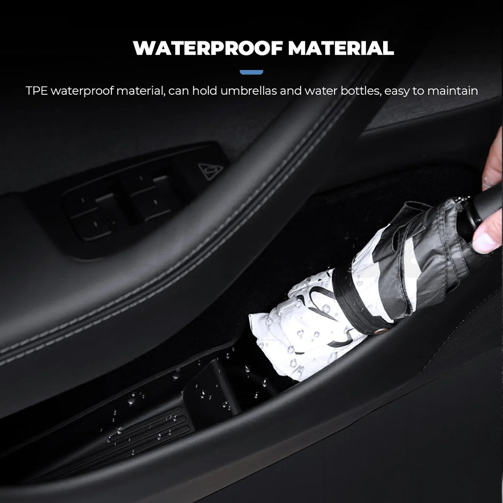 Tesla Model Y Juniper waterproof TPE door tray holding a folded umbrella