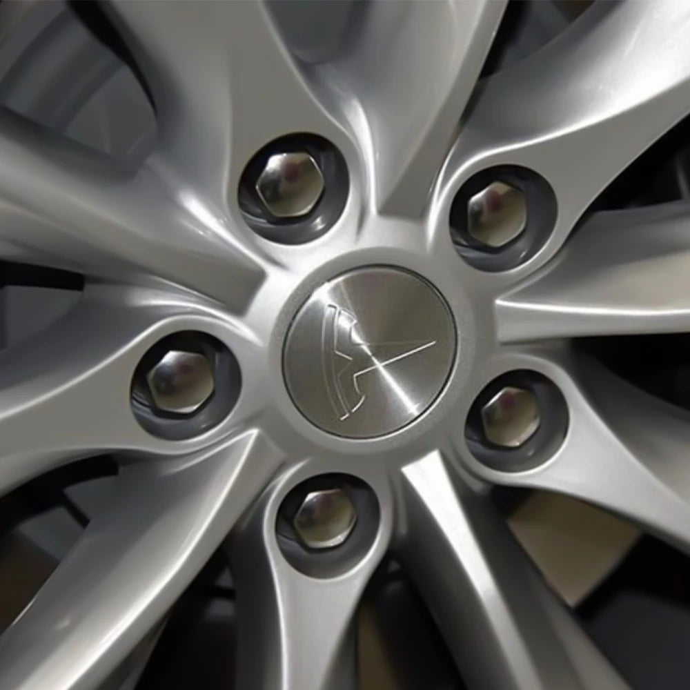 Tesla wheel center cap installed on a vehicle wheel