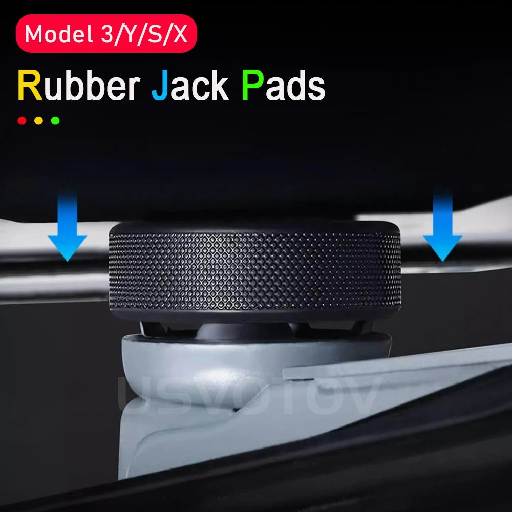 Close-up of a grooved rubber jack pad aligned under a Tesla jack point