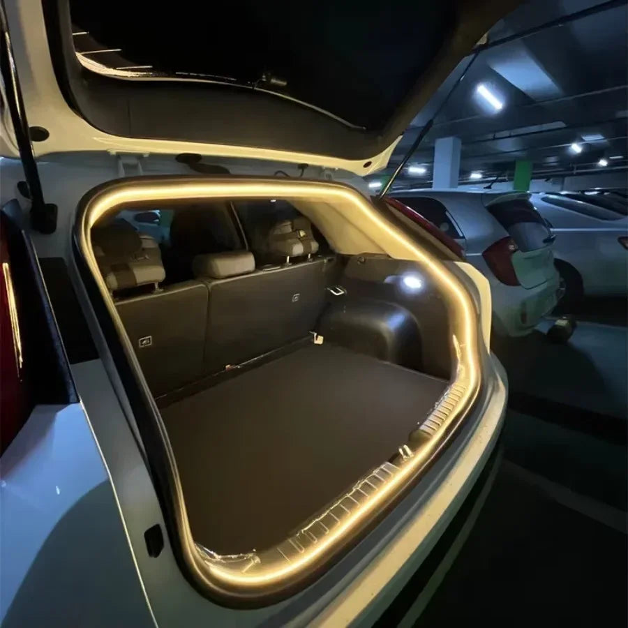 Car trunk with LED lighting, open hatchback in parking garage, spacious cargo area